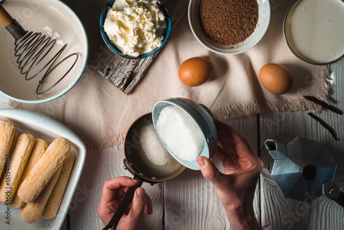 Cooking tiramisu on the white wooden table