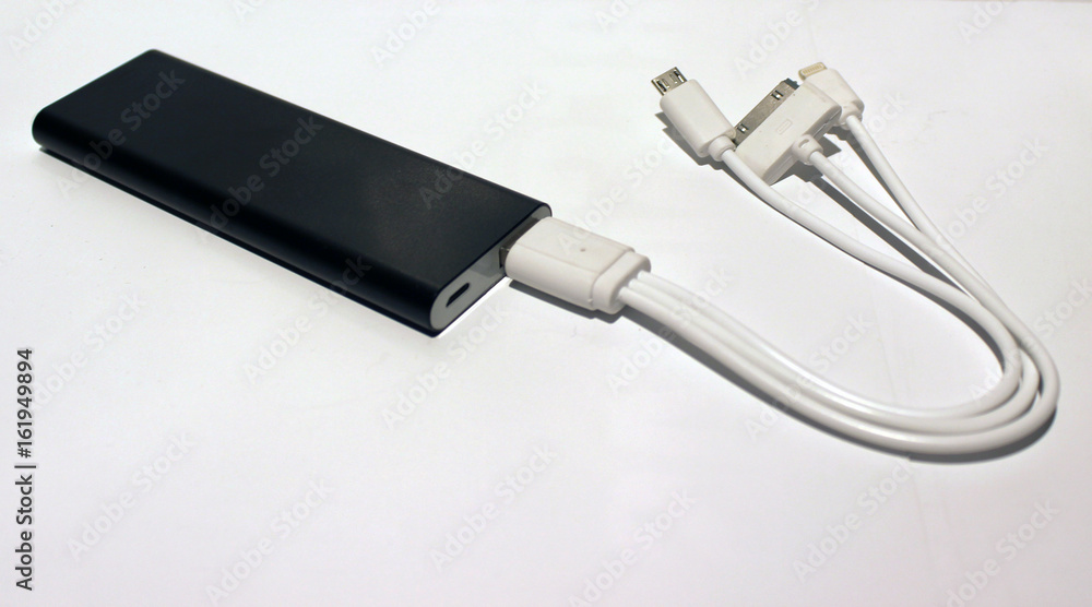 3000 mAH powerbank with multicore cable on the isolated white background 3000 mAH powerbank with multicore cable on the isolated white background