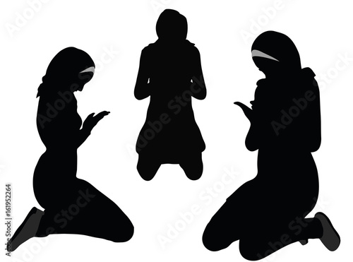 Muslim woman silhouette in pray pose