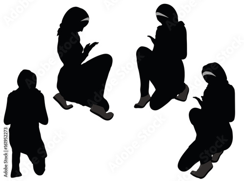 Muslim woman silhouette in pray pose