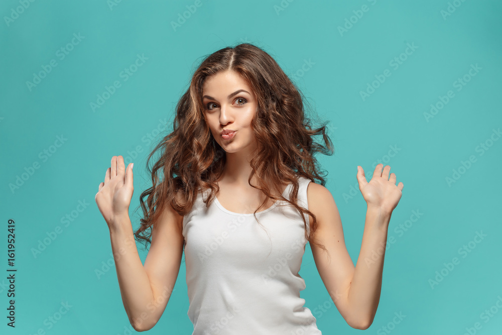 The young woman's portrait with happy emotions The young woman's portrait with happy emotions