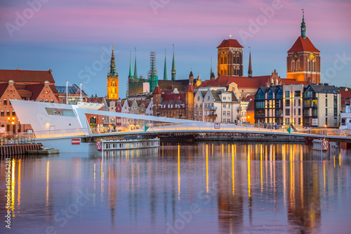Old town in Gdansk and catwalk over Motlawa river at sunset, Poland