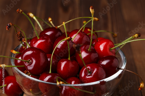 Bowl with fresh red Cherries. photo