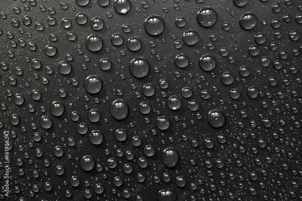 water drops on black background. Macro. water drops on black background. Macro.
