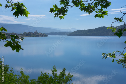 Village reflected in the water of Lake Ullibarri-Gamboa, Euskadi photo