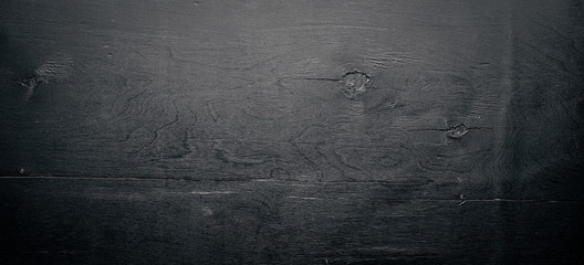 Wooden structural black background. Top view. Free space.