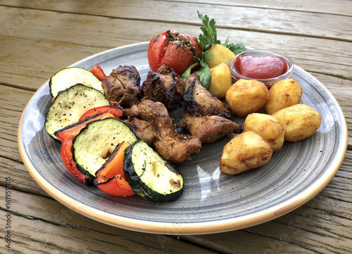 Traditional maltese food - rabbit with fresh vegetables. Malta. Fenek.