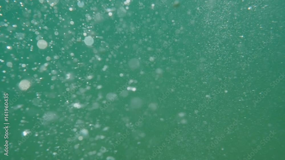 Bubbles rising to the surface. Air bubbles in water in sea (underwater shot), good for backgrounds. Slow motion.
Bubbles rising to the surface. Air bubbles in water in sea (underwater shot), good for backgrounds. Slow motion.