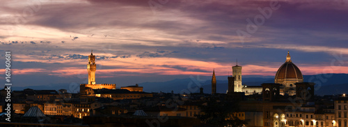 Beautiful view of the Old Palace, Giotto's Bell Tower and the Cathedral of Santa Maria del Fiore in Florence at sunset. Italy.
