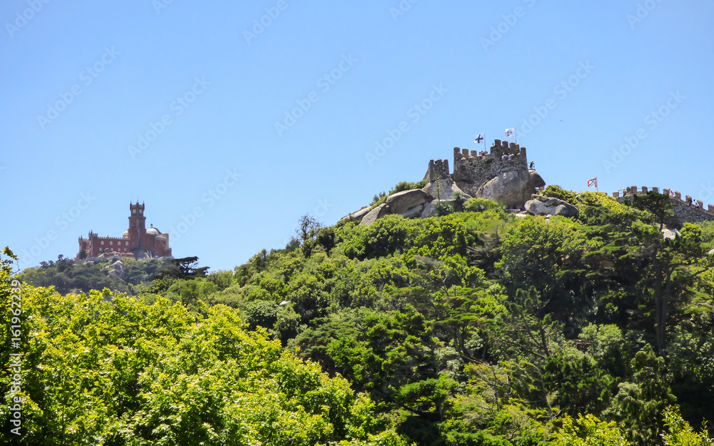 Walls of the Moorish Castle and Pena Palace in the background in Sintra, Portugal