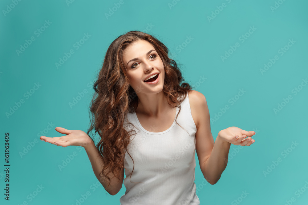The young woman's portrait with happy emotions The young woman's portrait with happy emotions