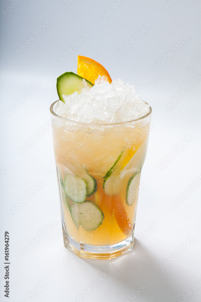 glass with orange cucumber refreshing drink, rustic style, selective focus glass with orange cucumber refreshing drink, rustic style, selective focus