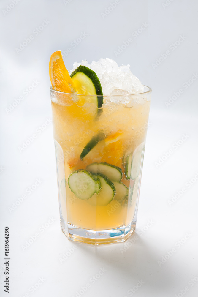 Fototapeta premium glass with orange cucumber refreshing drink, rustic style, selective focus