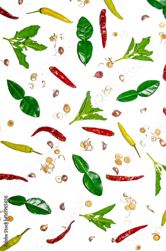 Group of condiment and ingredients on top of the table, Thai spicy ingredients with chili, garlic, lemongrass, lime leaf and basil on the white background for isolated