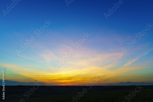 Fototapeta Naklejka Na Ścianę i Meble -  Sunset over a hill to the country in Romania
