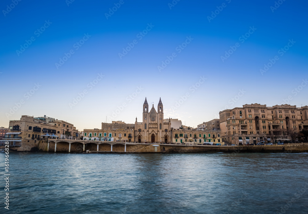 Balluta bay, Malta - Panoramic view of the famous Church of Our Lady of Mount Carmel at Balluta bay at sunrise
