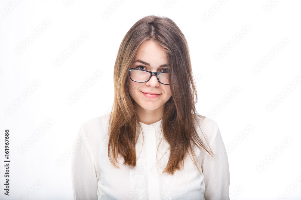 Beautiful young girl in glasses with a black rim a white shirt on an isolated background. Business concept Beautiful young girl in glasses with a black rim a white shirt on an isolated background. Business concept