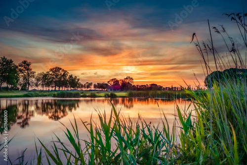 Obraz na plátně Lovely sunset in a typical Dutch landscape