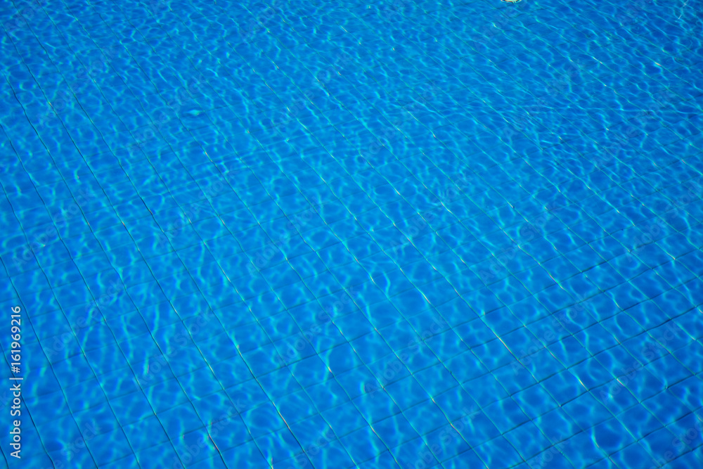 Blue ripple water in swimming pool  for background or wallpaper