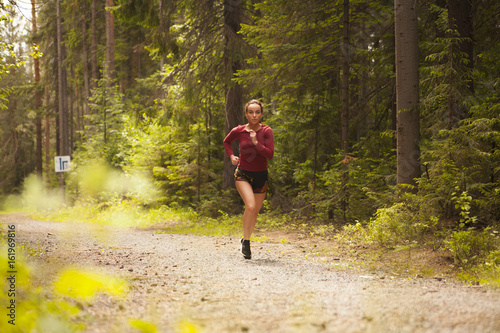 girl is Jogging in the woods