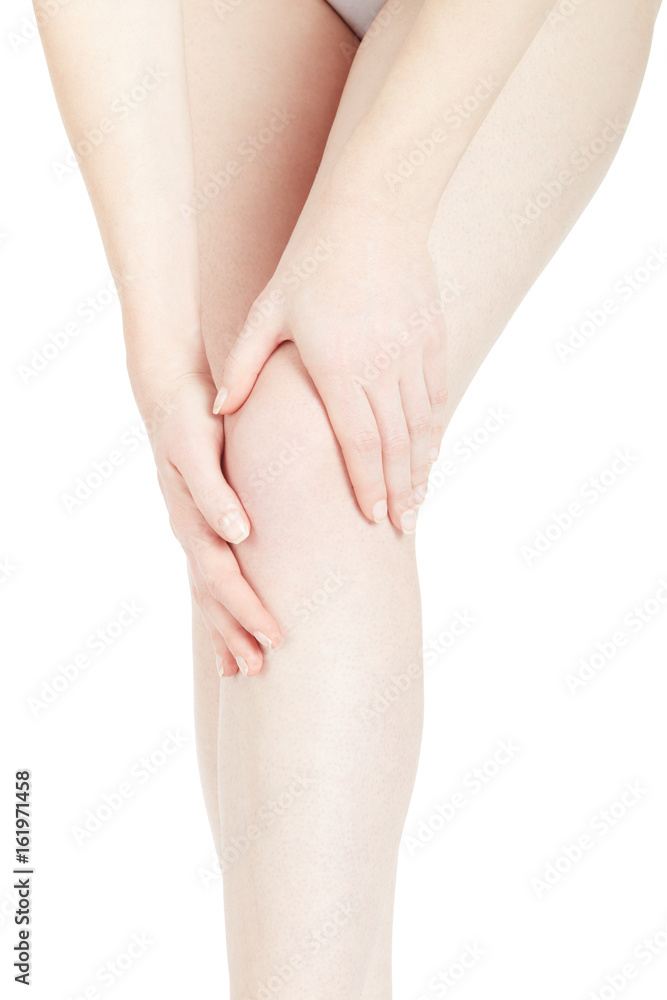 Young woman touching her leg feeling knee pain isolated on white, clipping path Young woman touching her leg feeling knee pain isolated on white, clipping path