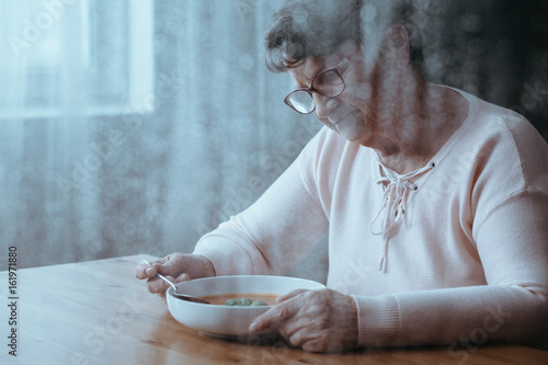 Woman eating soup photo