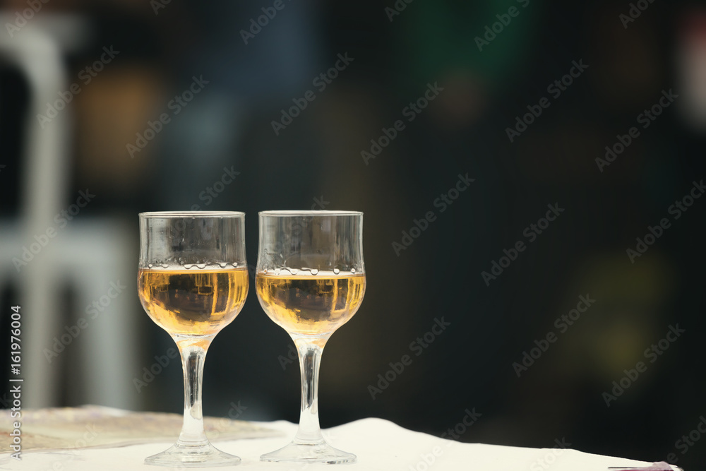 Fototapeta premium Glass of wine at the street cafe table