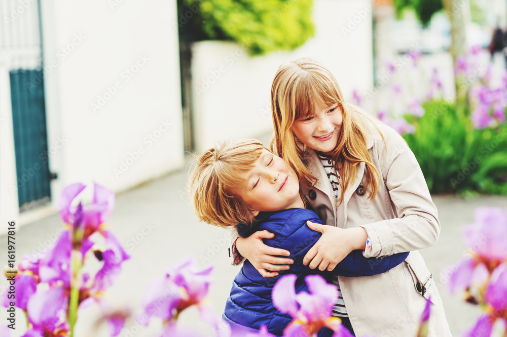 Two funny and happy kids playing together outdoors Stock Photo | Adobe