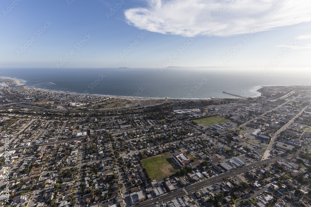 Aerial view of Ventura neighborhoods and the Pacific Ocean in Southern California. Aerial view of Ventura neighborhoods and the Pacific Ocean in Southern California.