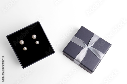 gift boxes for Pearl earrings. jewelry box on a white background. top view. gift concept.