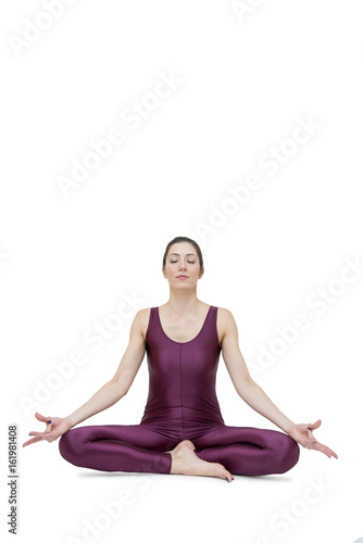 Woman practicing yoga in Muktasana pose