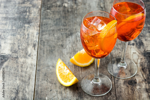 Aperol spritz cocktail in glass on wooden table
 photo