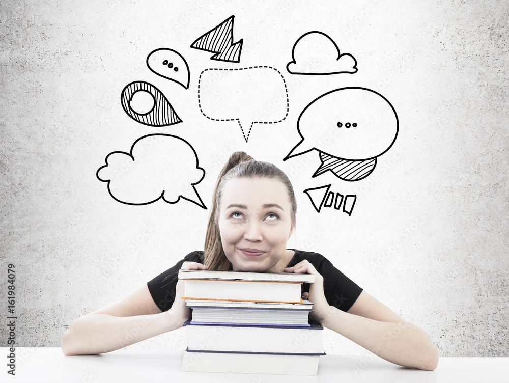 Fototapeta premium Dreamy student with a pile of books speech bubbles
