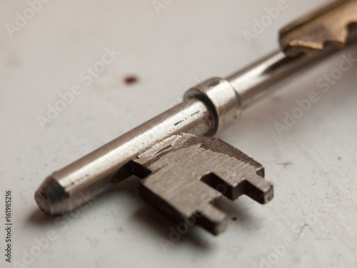 metal key close up on white