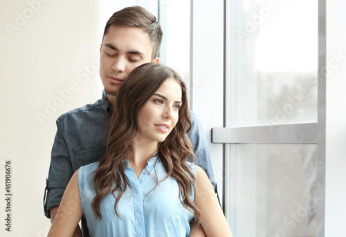 Beautiful young couple at home