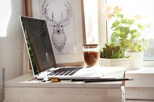 Wallpaper Mural Creative workplace with laptop near windowsill in modern room Torontodigital.ca