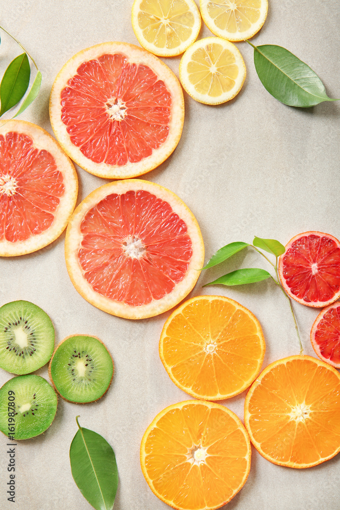 Citrus slices on light background