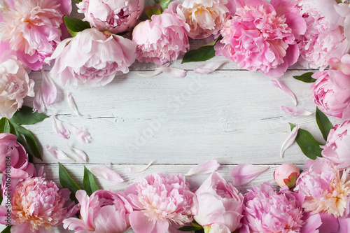 Fototapeta Naklejka Na Ścianę i Meble -  Pink peonies on a wooden background