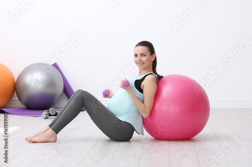 Beautiful pregnant woman do...