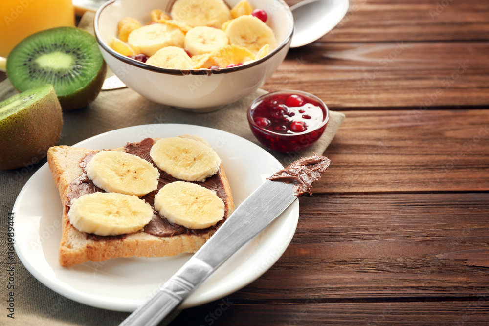 Delicious breakfast served on wooden table