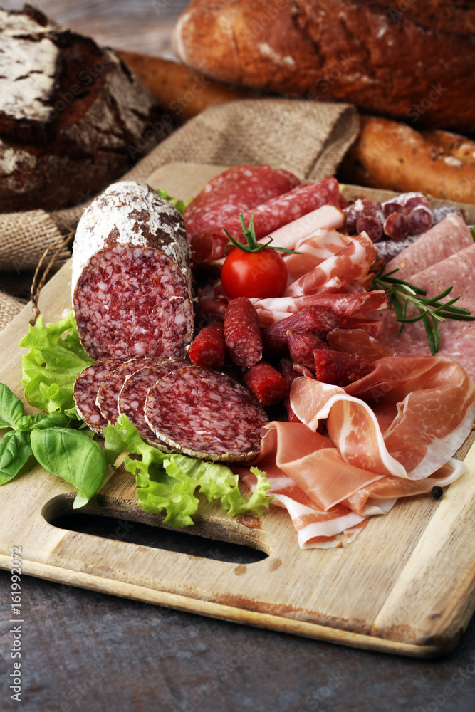 Food tray with delicious salami, pieces of sliced ham, sausage, Food tray with delicious salami, pieces of sliced ham, sausage,