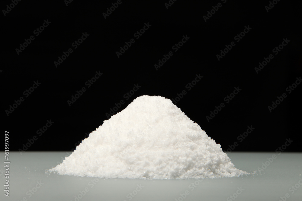 Salt/ A handful of salt on the table. Cooking salt Stock Photo | Adobe Stock