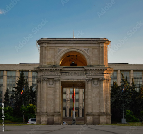 Triumphal arch of chisinau with flag of Moldavia. 