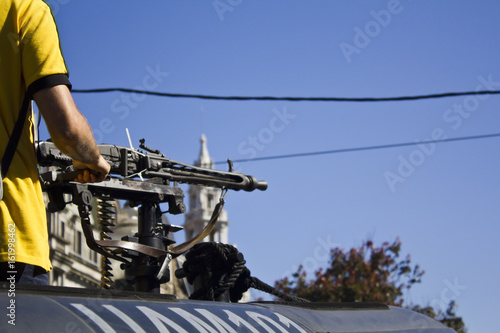 Man trying a military machine gun
