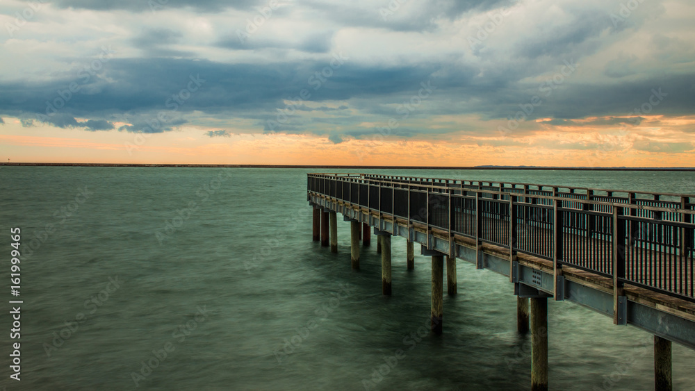Obraz premium Pier Under Heavy Clouds