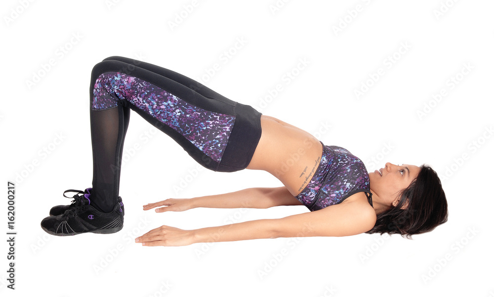 Exercising woman making a bridge. Exercising woman making a bridge.
