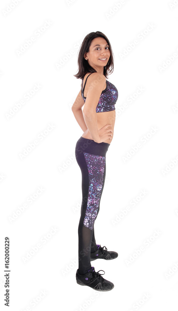 Happy young woman standing in profile. Happy young woman standing in profile.