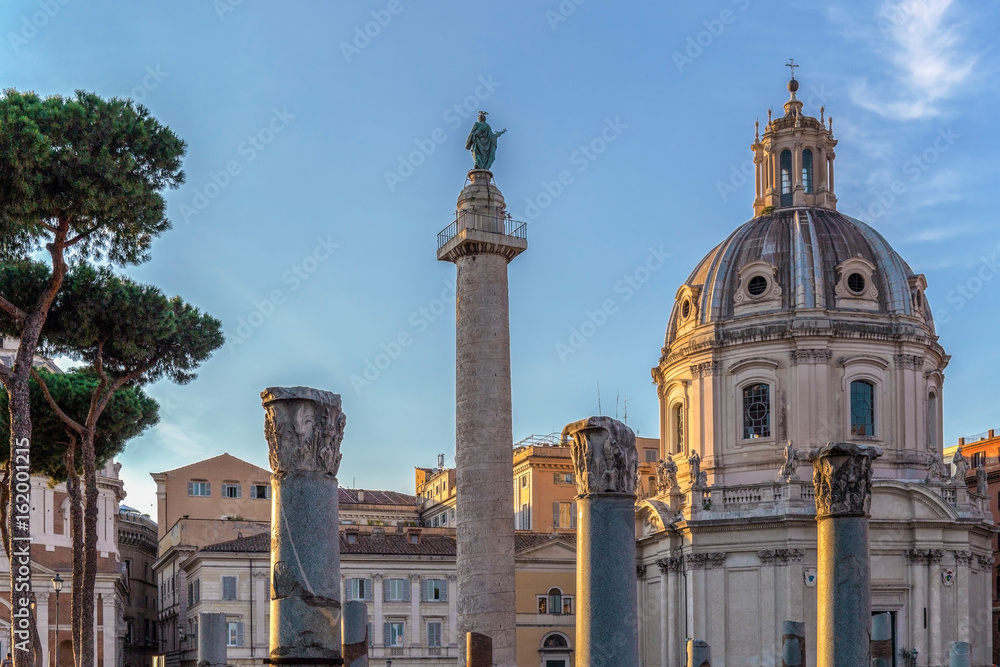 Trajan column, churche of Santa Maria di Loreto, and ruins of Trajan forum at dusk