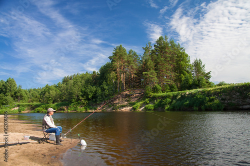 Fishing on the river in a rural place on a summer day.