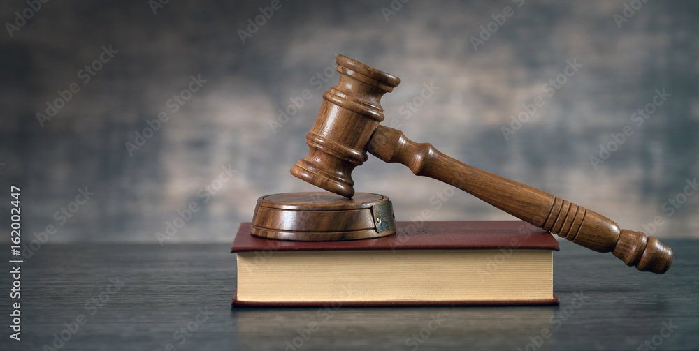 Symbols of the law on a rustic desk Symbols of the law on a rustic desk